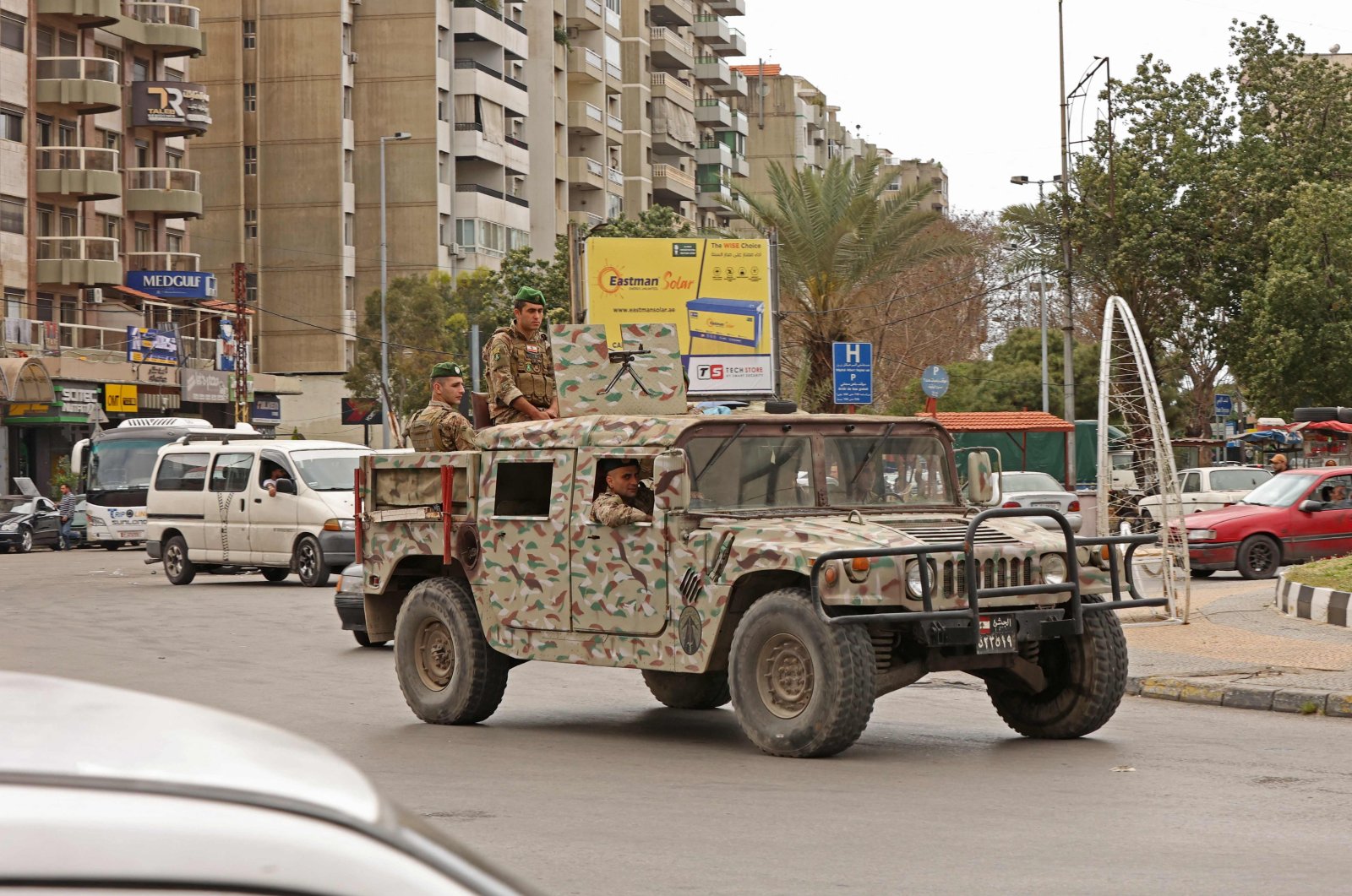 Soldiers ride an armored vehicle in Tripoli on April 26, 2023. (AFP File Photo)