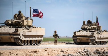 U.S. Bradley Fighting Vehicles (BFV) patrol the countryside of the city of Qamishli in Syria's northeastern Hassakeh province, April 20, 2022. (AFP File Photo)