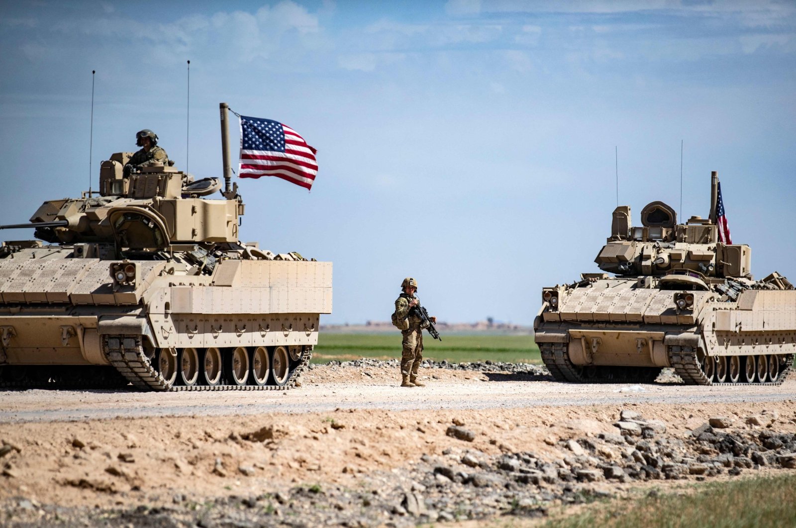 U.S. Bradley Fighting Vehicles (BFV) patrol the countryside of the city of Qamishli in Syria&#039;s northeastern Hassakeh province, April 20, 2022. (AFP File Photo)