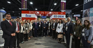 Representatives from Turkish universities are posing next to the stand during an international education expo in Washington DC, U.S., May 30, 2023. (AA Photo)