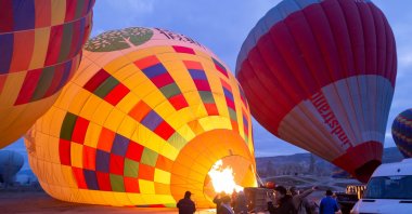 Hot air balloons prepare to take off over the spectacular Cappadocia region, Türkiye, Jan. 12, 2020. (Shutterstock Photo)