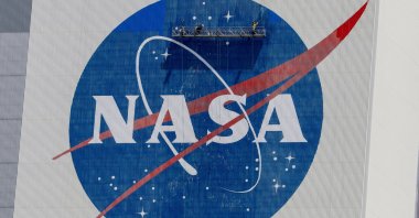Workers pressure wash the logo of NASA on the Vehicle Assembly Building before SpaceX will send two NASA astronauts to the International Space Station aboard its Falcon 9 rocket, at the Kennedy Space Center in Cape Canaveral, Florida, U.S., May 19, 2020. (Reuters File Photo)
