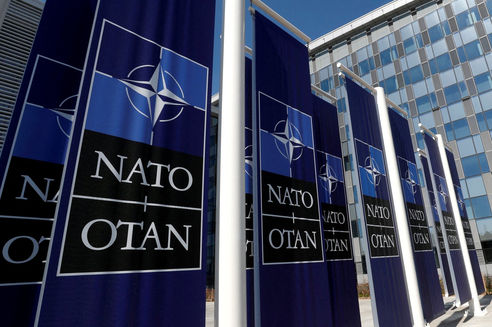 Banners displaying the NATO logo at the entrance of new NATO headquarters, in Brussels, Belgium, April 19, 2018. (Reuters Photo)