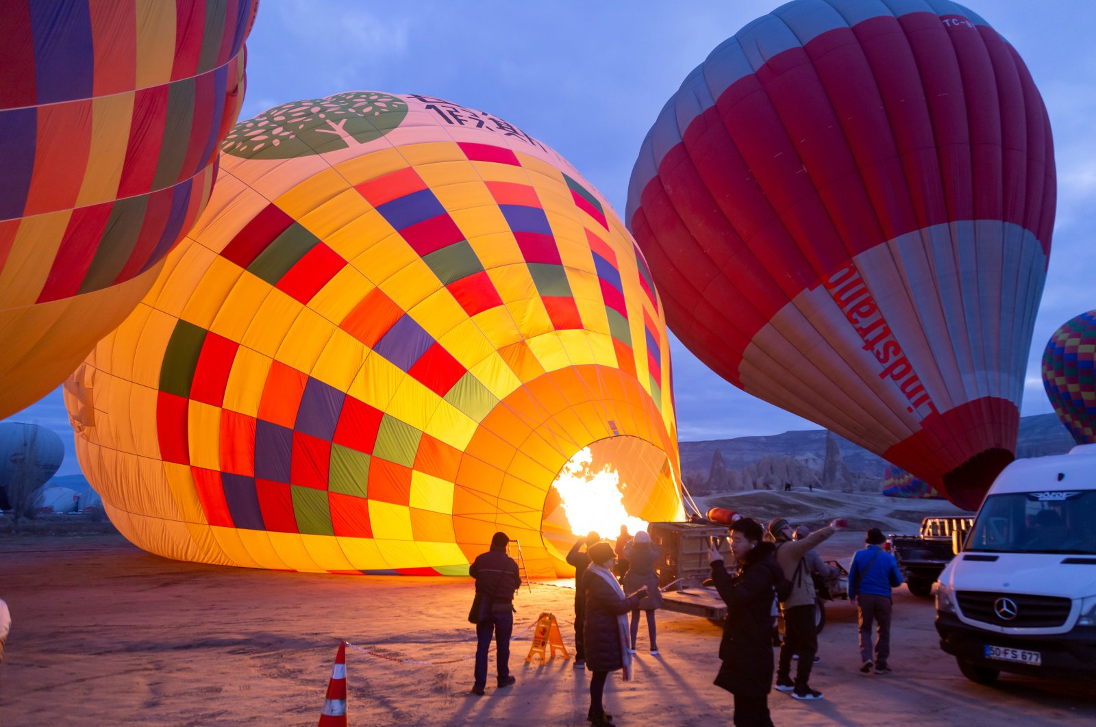 Hot air balloons prepare to take off over the spectacular Cappadocia region, Türkiye, Jan. 12, 2020. (Shutterstock Photo)