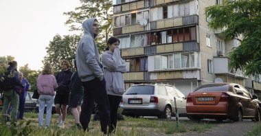 Locals react as they stand near a health center damaged in a missile strike in Kyiv, Ukraine, June 1, 2023. (EPA Photo)