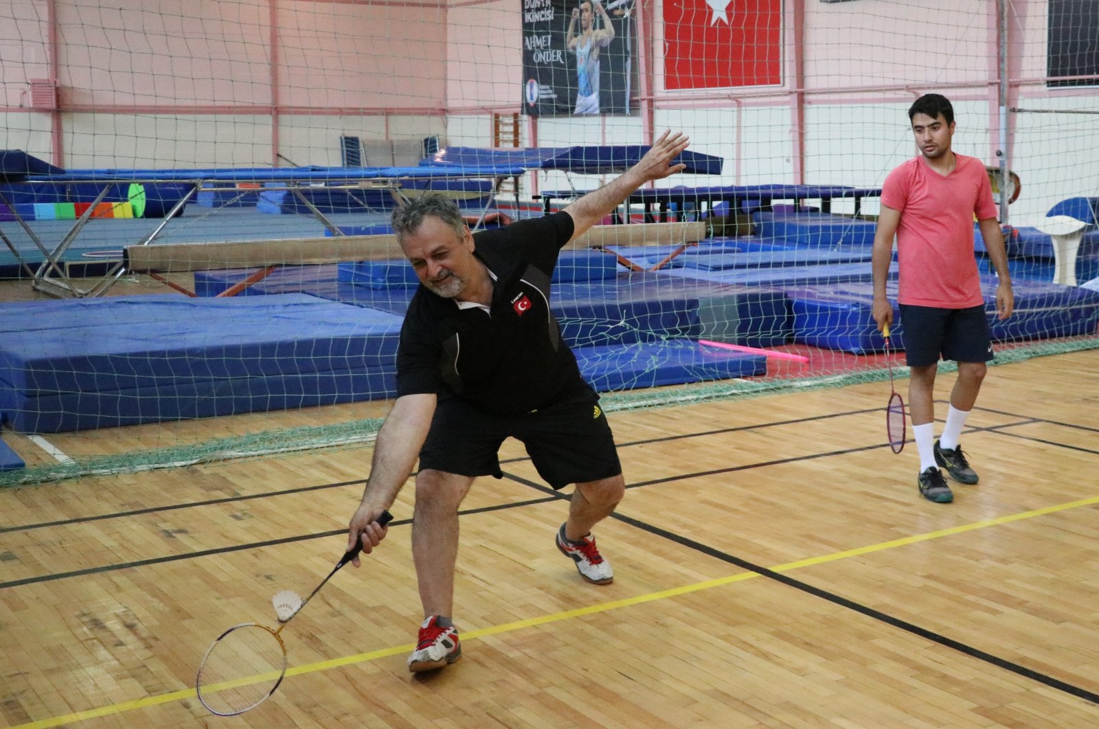 The Turkish Deaf Sports Federation (TİESF) badminton national team head coach Cavit Şengün (L) trains his team ahead of the world championship in Brazil, Karabük, Türkiye, May 30, 2023. (AA Photo)