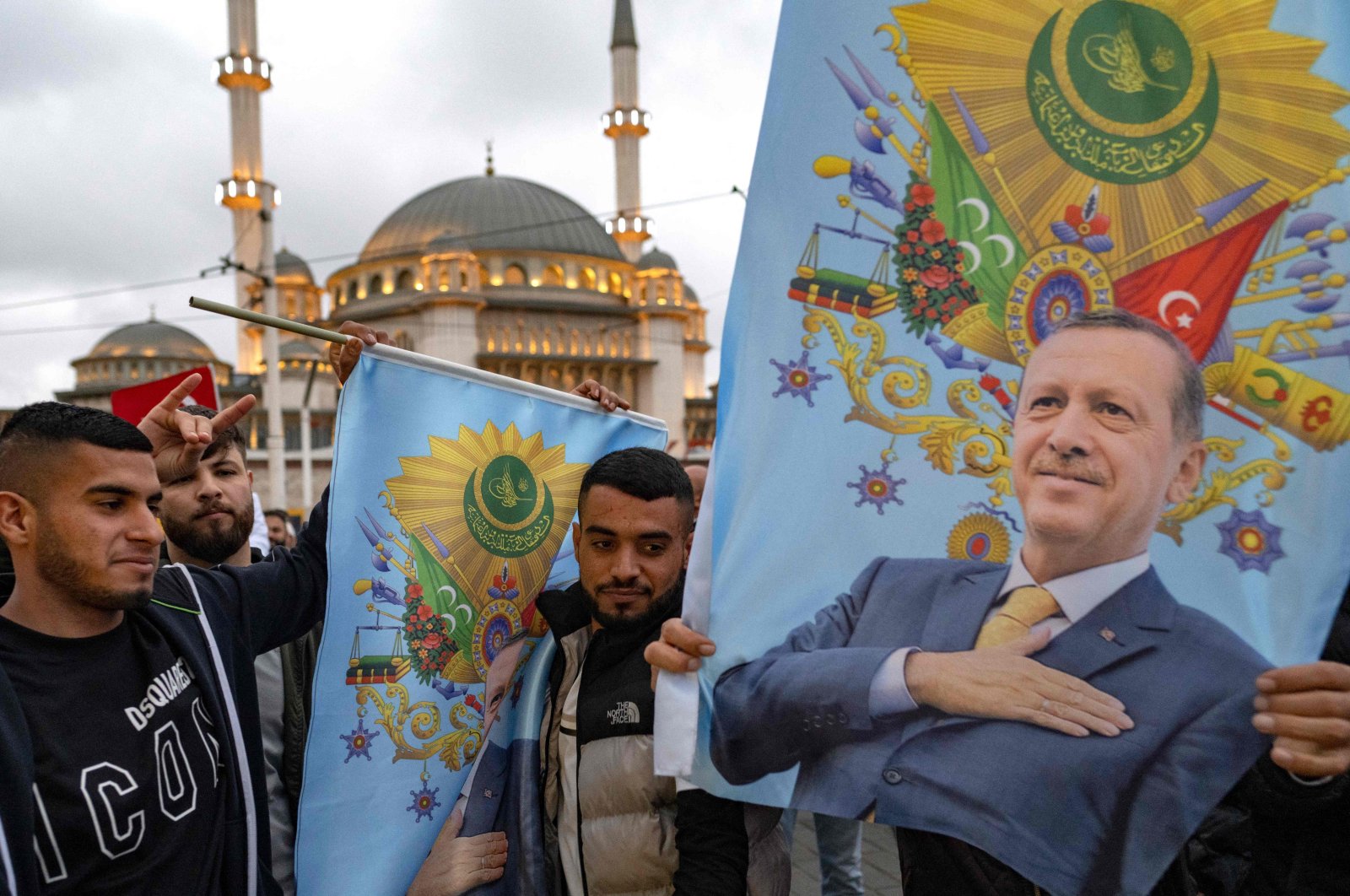 Supporters of President Recep Tayyip Erdoğan celebrate near Taksim Mosque at the Taksim Square in Istanbul on the day of the presidential runoff vote in Istanbul, May 28, 2023. (AFP Photo)