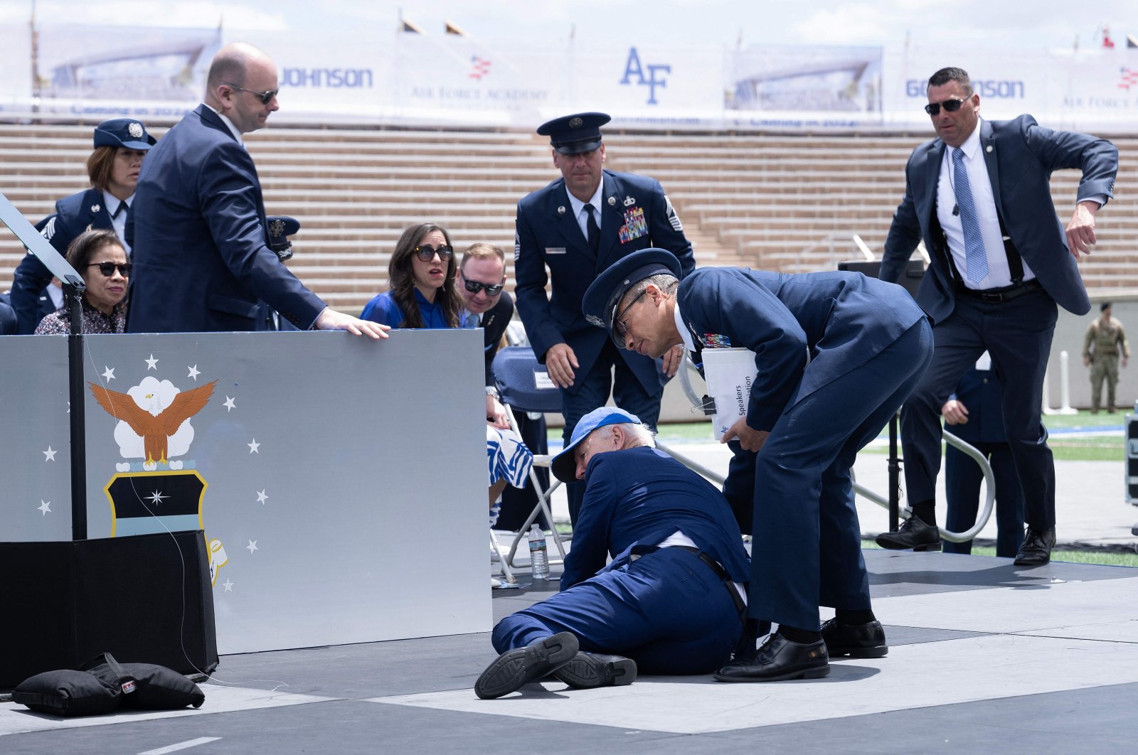 U.S. President Joe Biden is helped up after falling during the graduation ceremony at the Air Force Academy, just north of Colorado Springs in El Paso County, Colorado, June 1, 2023. (AFP Photo)