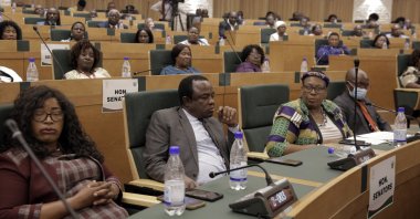 Members of parliament listen to Zimbabwean President Emmerson Mnangagwa delivering his State of the Nation Address at the Parliament building in Mt Hampden, Harare, Zimbabwe, Nov. 23, 2022.(AP Photo)