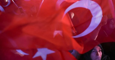 A supporter of President Recep Tayyip Erdoğan looks on following early exit poll results for the second round of the presidential election in Ankara, Türkiye, May 28, 2023. (Reuters Photo)
