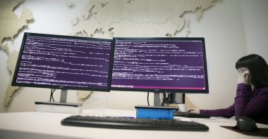 A computer code is seen on displays in a company office in Moscow, Russia, Oct. 25, 2017. (AP Photo)