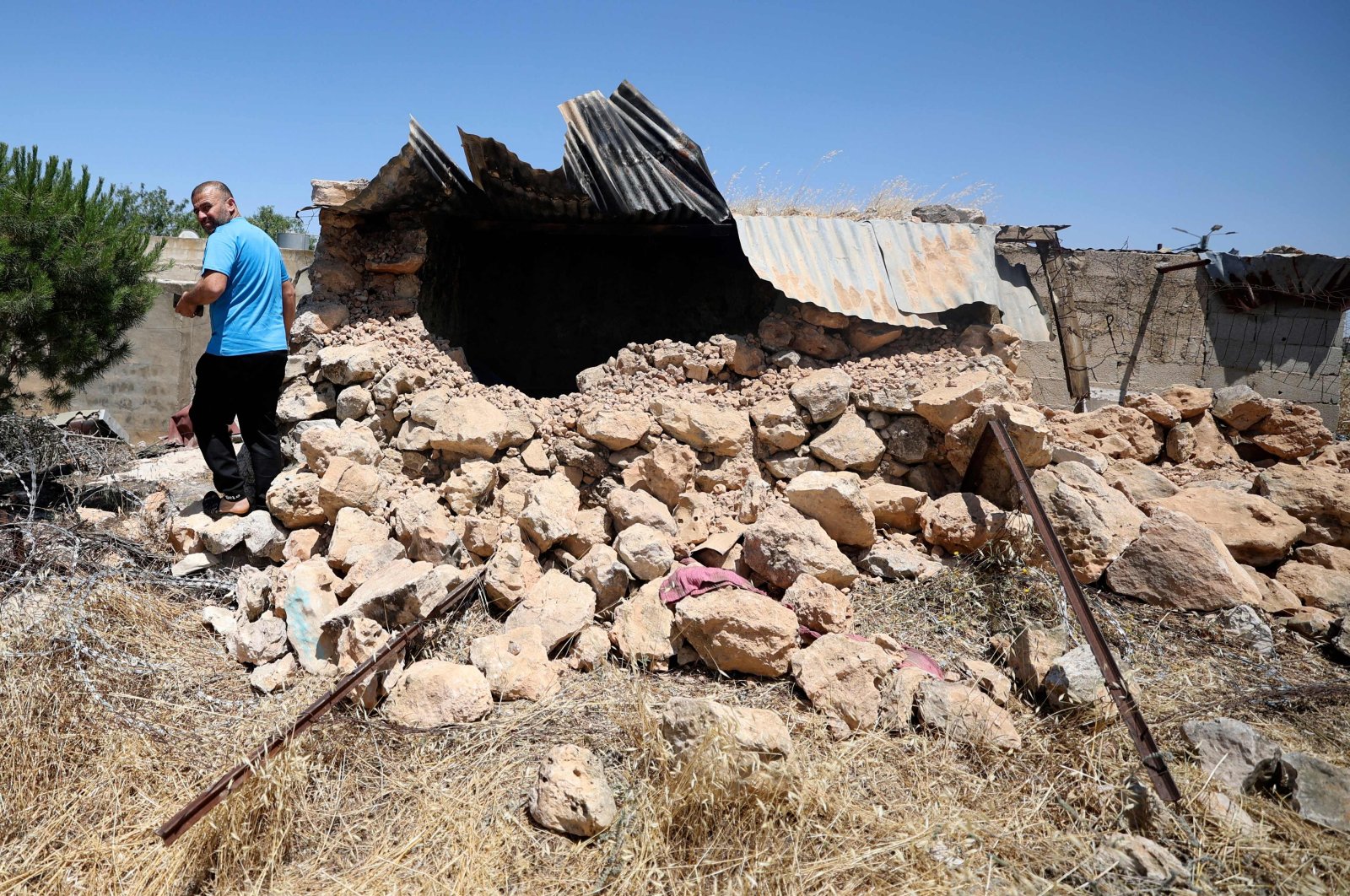 A man checks the destruction of parts of a house reportedly attacked by Israeli settlers, in the West Bank village of Jalud, Palestine, May 31, 2023. (AFP Photo)