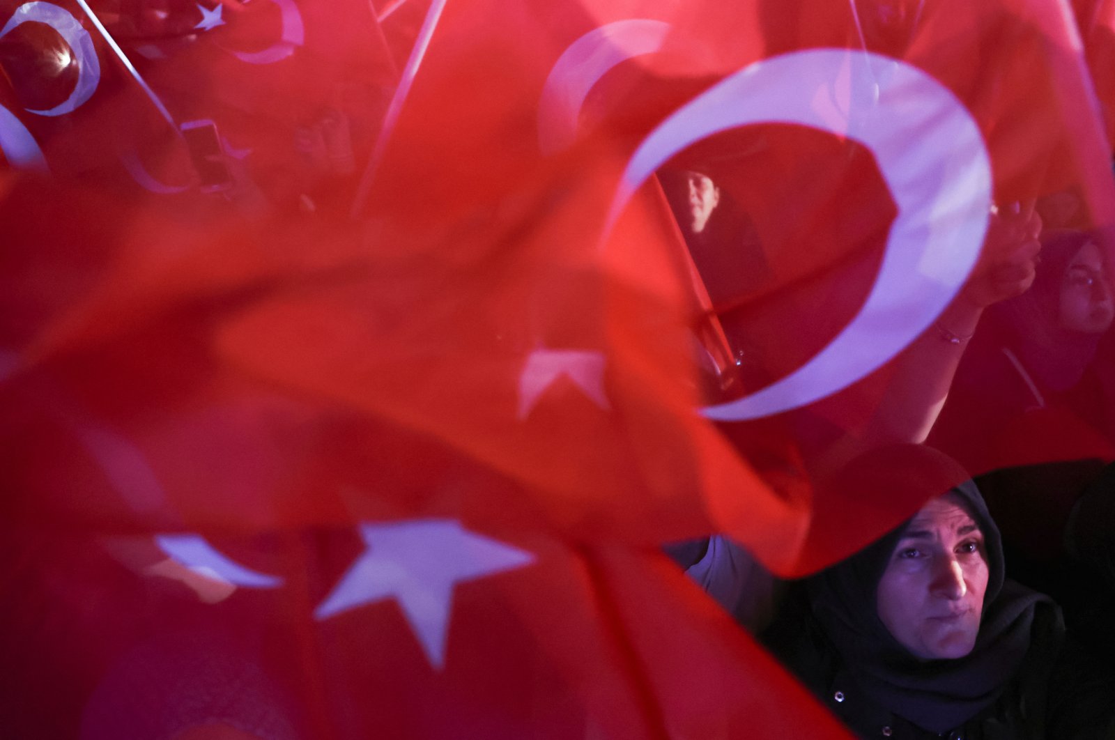 A supporter of President Recep Tayyip Erdoğan looks on following early exit poll results for the second round of the presidential election in Ankara, Türkiye, May 28, 2023. (Reuters Photo)