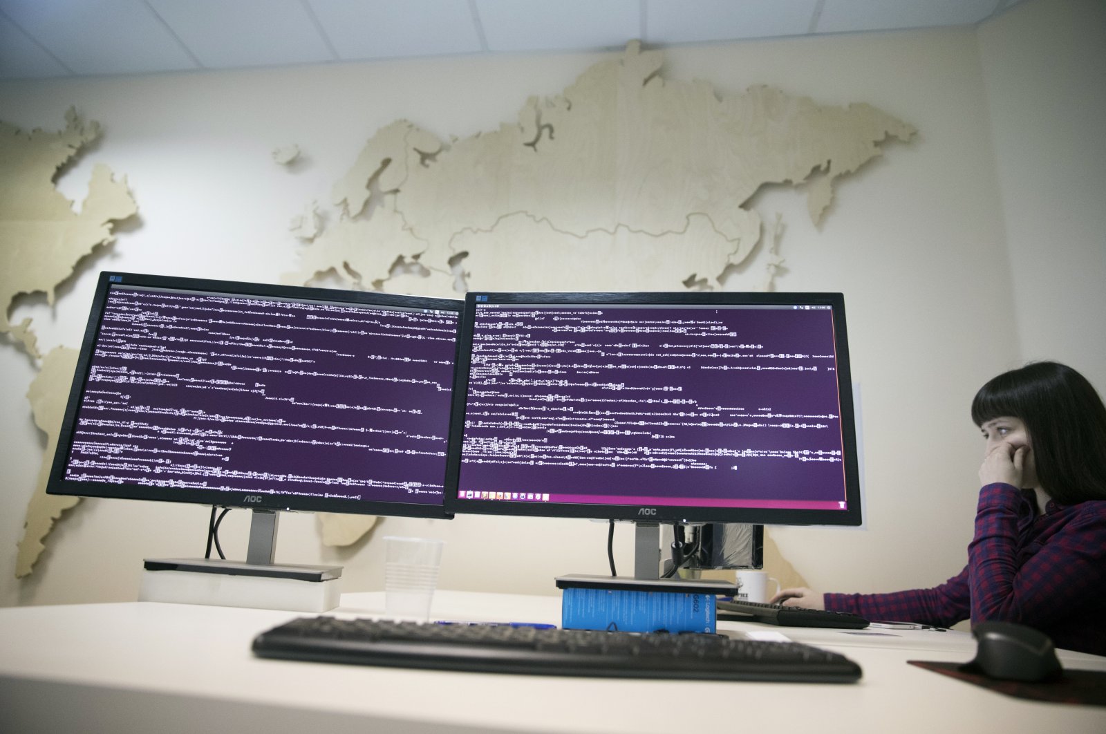 A computer code is seen on displays in a company office in Moscow, Russia, Oct. 25, 2017. (AP Photo)