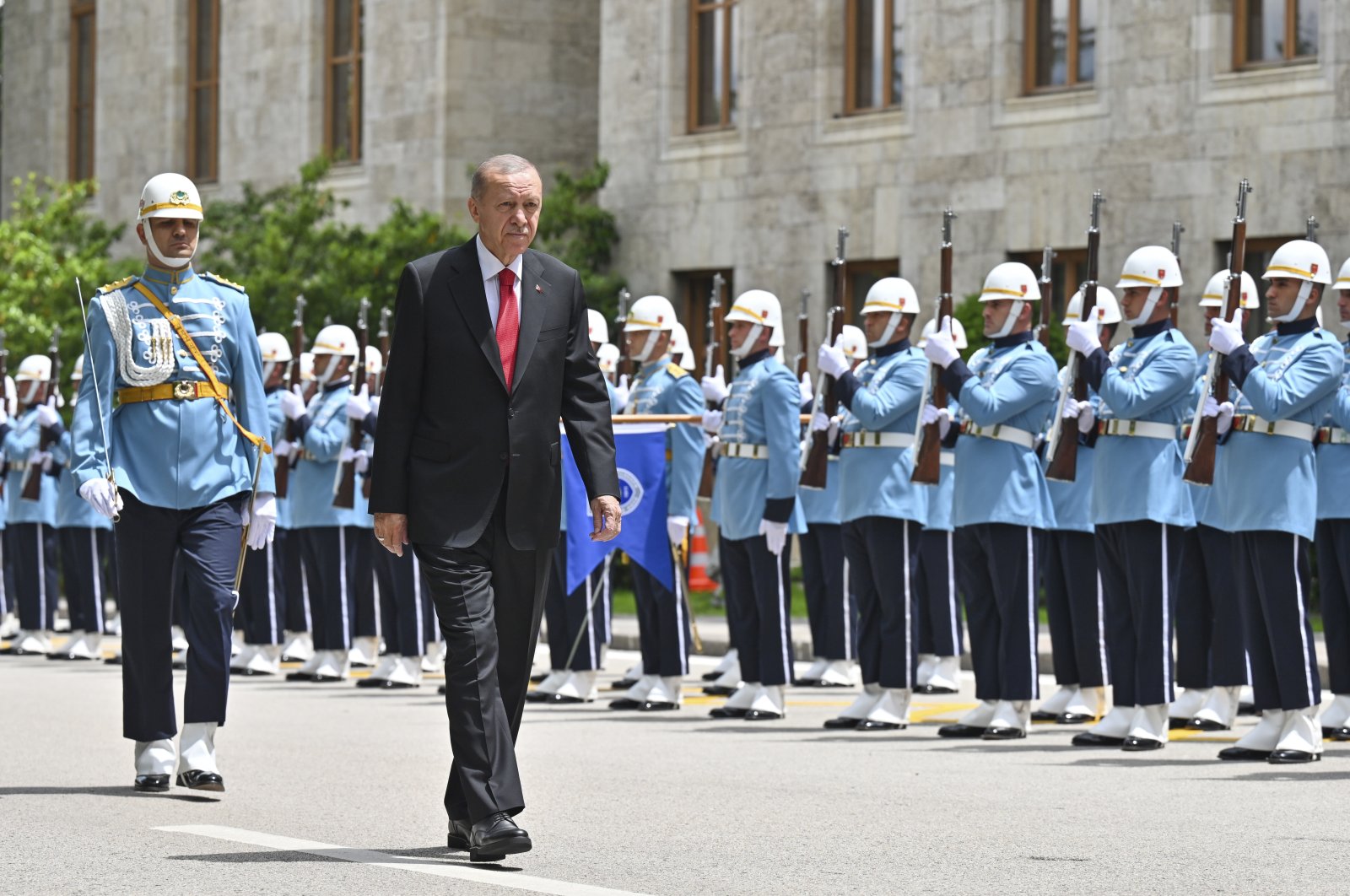 President Recep Tayyip Erdoğan reviews a military honor guard as he arrives to join newly elected legislators at the Grand National Assembly, in Ankara, Friday, June 2, 2023. (AP Photo)