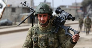 A Turkish soldier patrols with troops in the town of Atareb, western countryside of Aleppo province, Syria, Feb. 19, 2020. (AFP Photo)