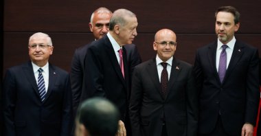 President Recep Tayyip Erdoğan walks next to the new Treasury and Finance Minister Mehmet Şimşek during a news conference where the new cabinet was announced, in Ankara, June 3, 2023. (Reuters Photo)