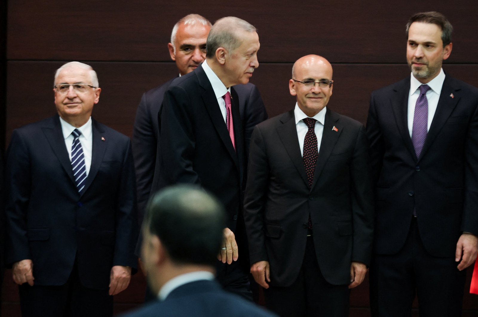President Recep Tayyip Erdoğan walks next to the new Treasury and Finance Minister Mehmet Şimşek during a news conference where the new cabinet was announced, in Ankara, June 3, 2023. (Reuters Photo)