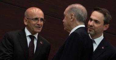 President Recep Tayyip Erdoğan shakes hands with the new treasury and finance minister, Mehmet Şimşek, during a news conference where the new Cabinet was announced, in Ankara, Türkiye, June 3, 2023. (Reuters Photo)