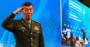 Chinese Defense Minister Li Shangfu salutes the audience at the 20th Shangri-La Dialogue summit in Singapore, June 4, 2023. (AFP Photo)