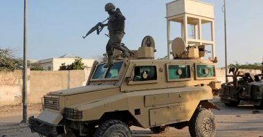 A soldier serving in the African Union Mission in Somalia (AMISOM) jumps off a military vehicle in Mogadishu, Somalia, Nov. 11, 2021. (Reuters Photo)