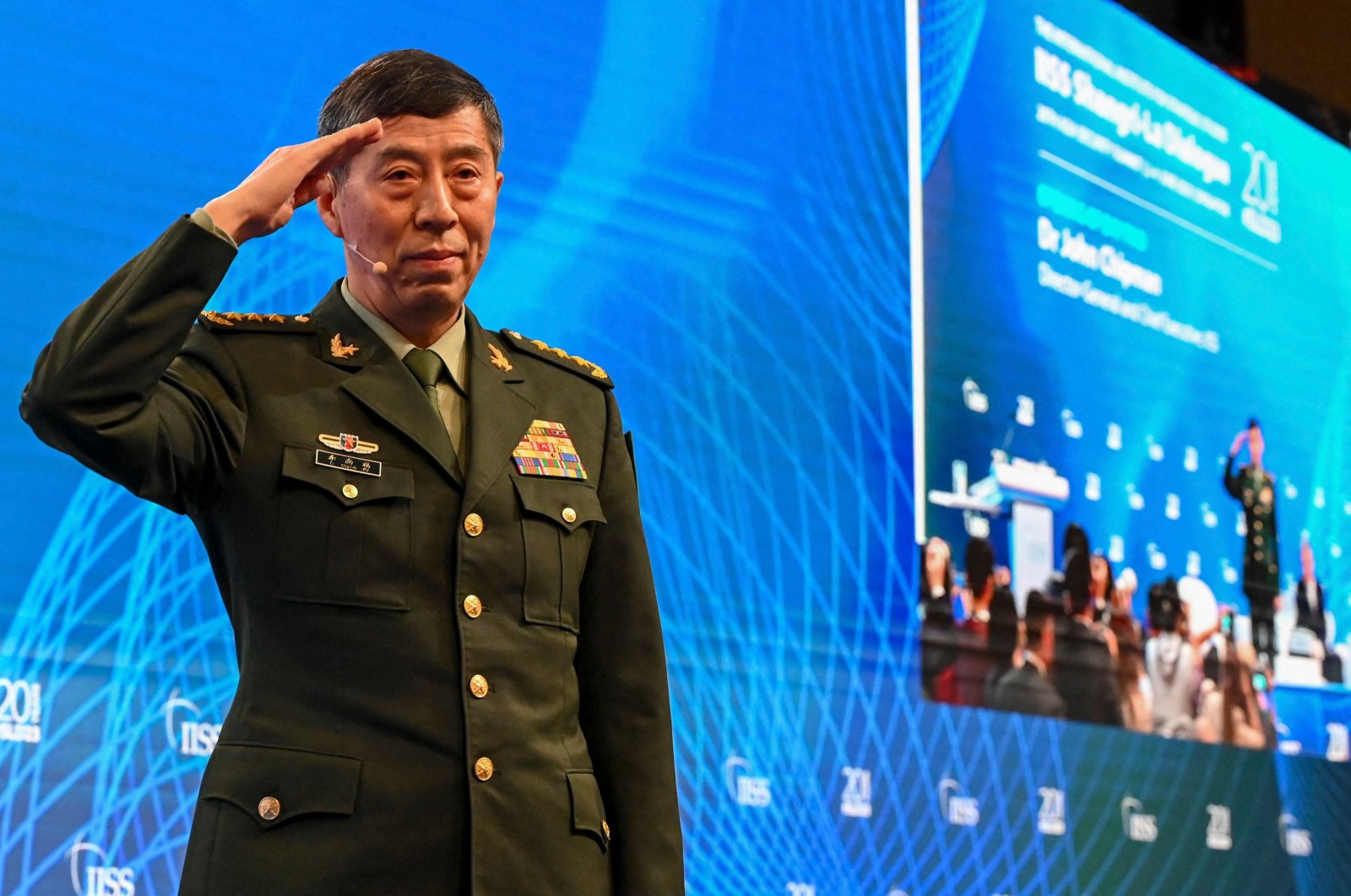 Chinese Defense Minister Li Shangfu salutes the audience at the 20th Shangri-La Dialogue summit in Singapore, June 4, 2023. (AFP Photo)