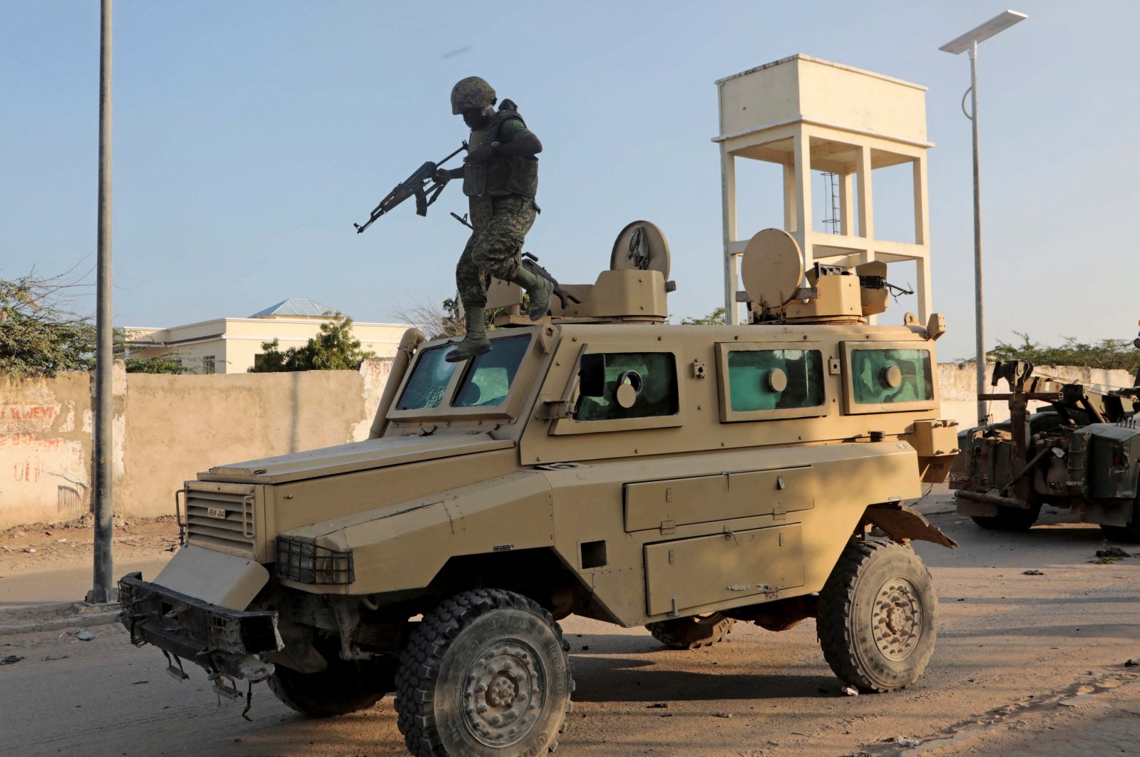 A soldier serving in the African Union Mission in Somalia (AMISOM) jumps off a military vehicle in Mogadishu, Somalia, Nov. 11, 2021. (Reuters Photo)