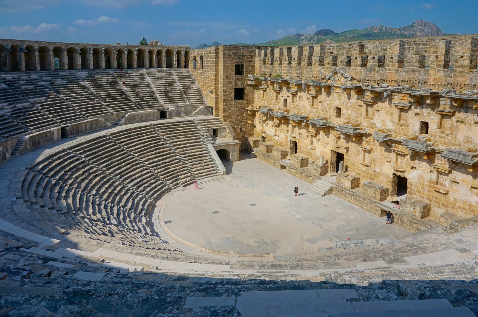 Tourists visit the Aspendos,Theater, in Antalya, Türkiye, June 10, 2018. (Shutterstock Photo)