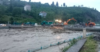 Forklifts are seen cleaning the area around a collapsed bridge amid raging floodwaters, Kastamonu, northern Türkiye, June 5, 2023. (IHA Photo)