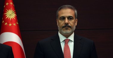 Foreign Minister Hakan Fidan stands as President Recep Tayyip Erdoğan unveils his new Cabinet at Çankaya Palace after he was sworn in as president in Parliament, Ankara, Türkiye, June 3, 2023. (AFP Photo)