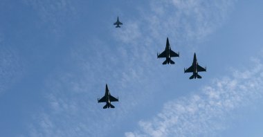A formation of U.S. Air Force F-16 Fighting Falcons flies over during Arlington National Cemetery, Virginia, U.S., Nov. 11, 2021. (AP Photo)