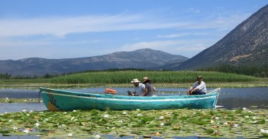 A tourist boat is seen sailing on Lake Işıklı, Denizli, Türkiye, June 5, 2023. (IHA Photo)