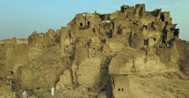 An aerial view of the fortress of Djaba and two guards walking around the site near Djado, Niger, May 21, 2023. (AFP Photo)