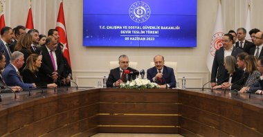 Türkiye’s newly appointed Labor and Social Security Minister Vedat Işıkhan (L) sits alongside his predecessor Vedat Bilgin during a handover ceremony, in Ankara, Türkiye, June 5, 2023. (AA Photo)