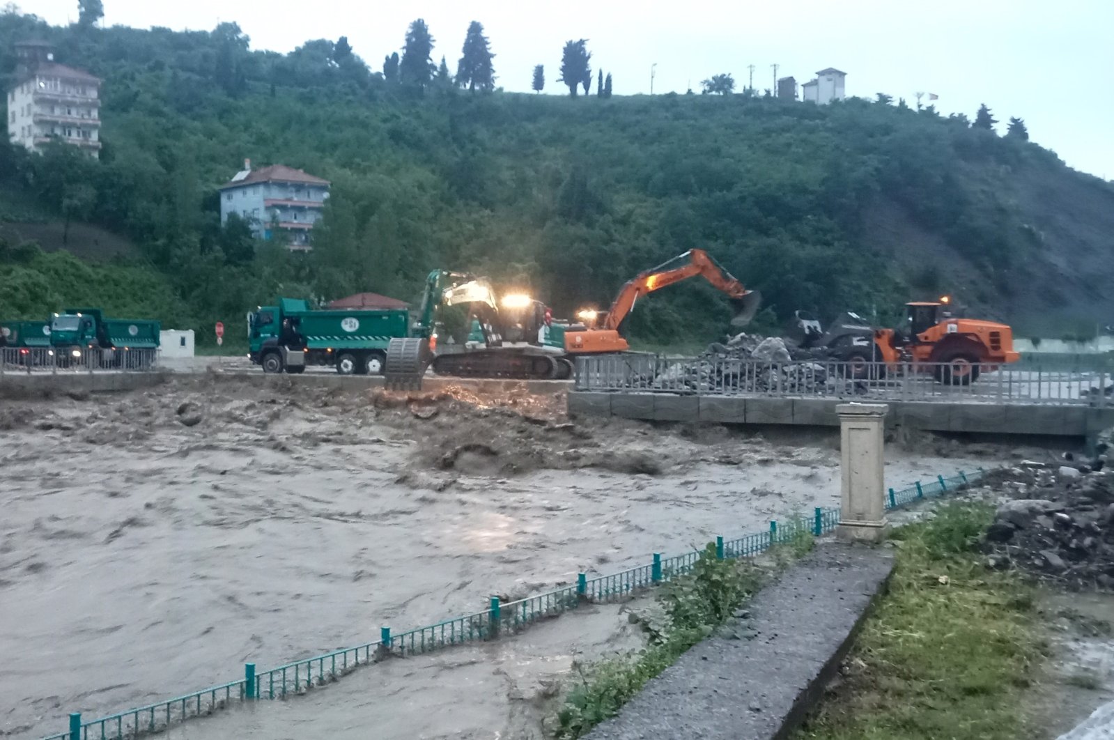 Forklifts are seen cleaning the area around a collapsed bridge amid raging floodwaters, Kastamonu, northern Türkiye, June 5, 2023. (IHA Photo)