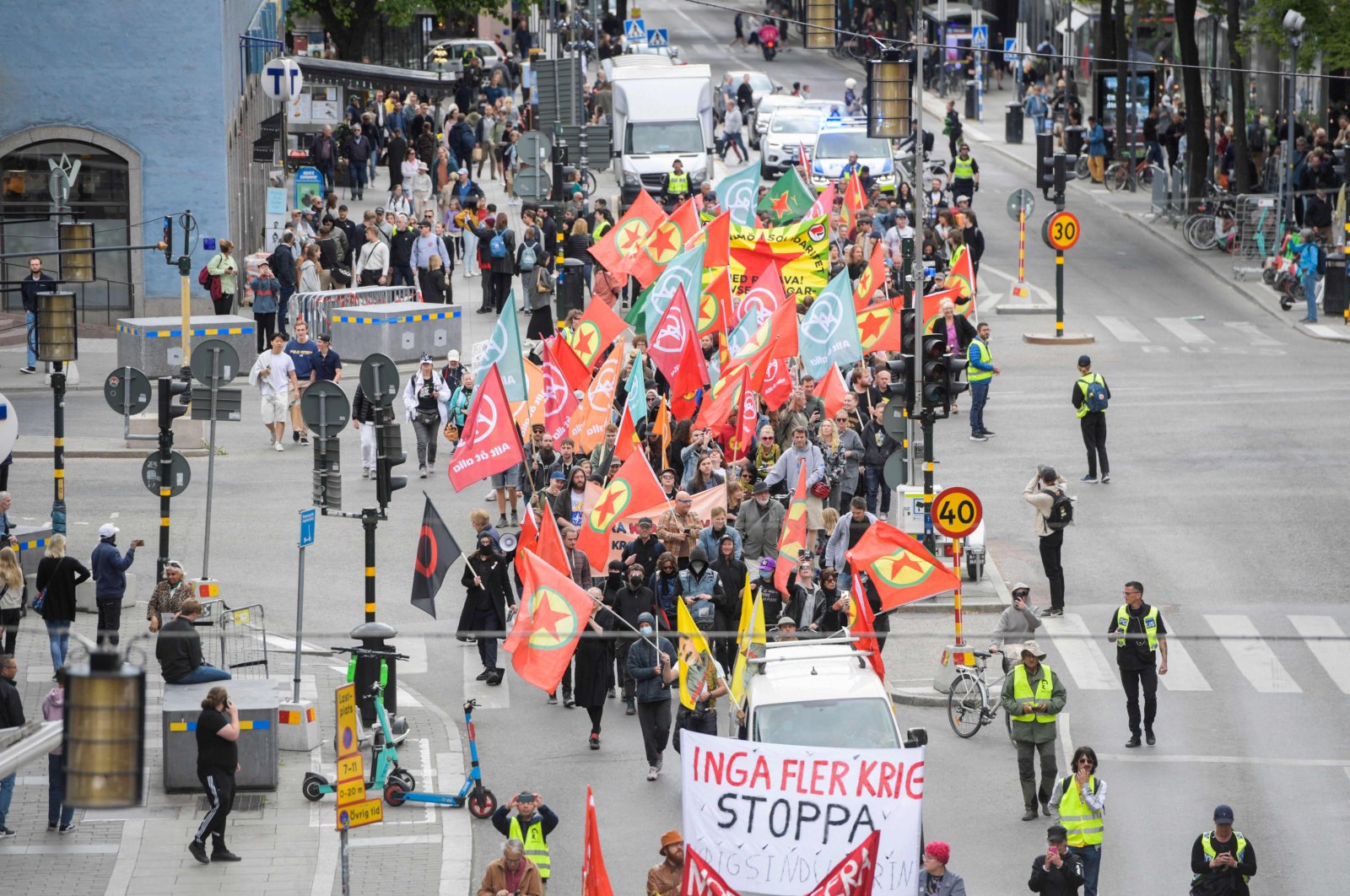 Flags with the logo of the PKK/YPG are seen during a demonstration against Swedish NATO membership and Türkiye, Stockholm, Sweden,  June 4, 2023. (AFP Photo)