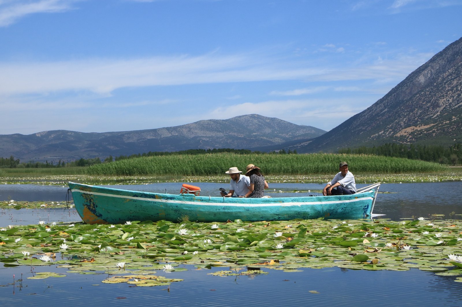 A tourist boat is seen sailing on Lake Işıklı, Denizli, Türkiye, June 5, 2023. (IHA Photo)