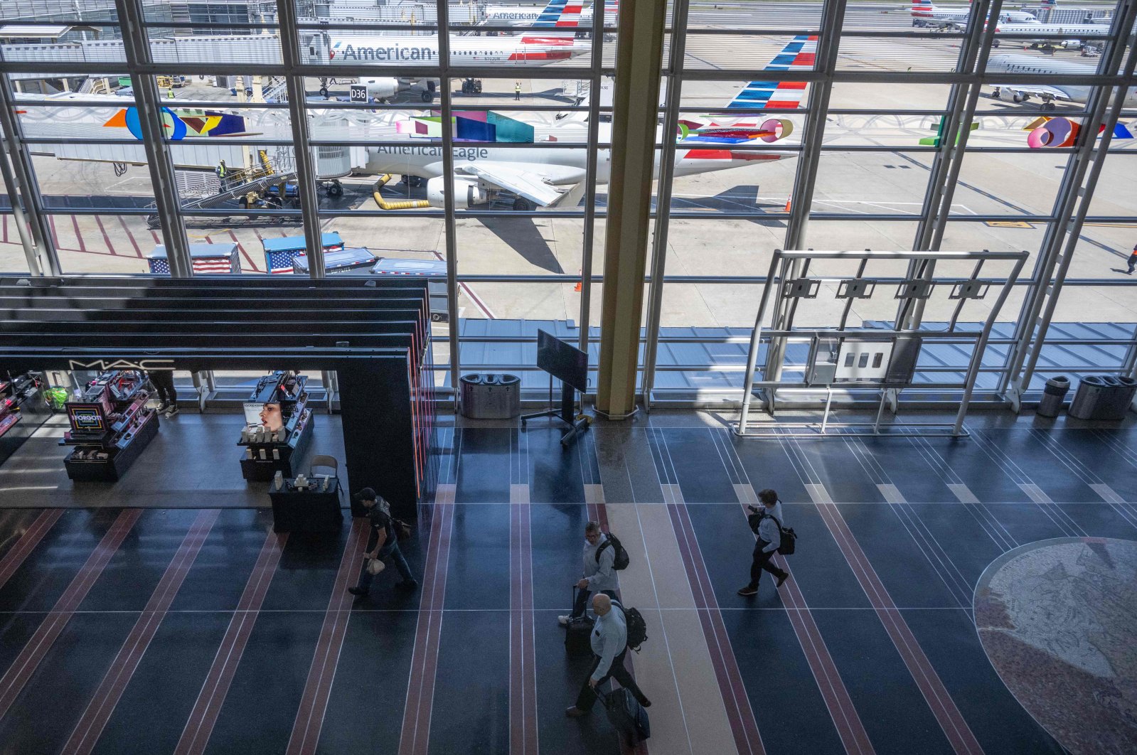 Passengers walk through at Regan National Airport in Arlington, Virginia, U.S., May 26, 2023. (AFP Photo)