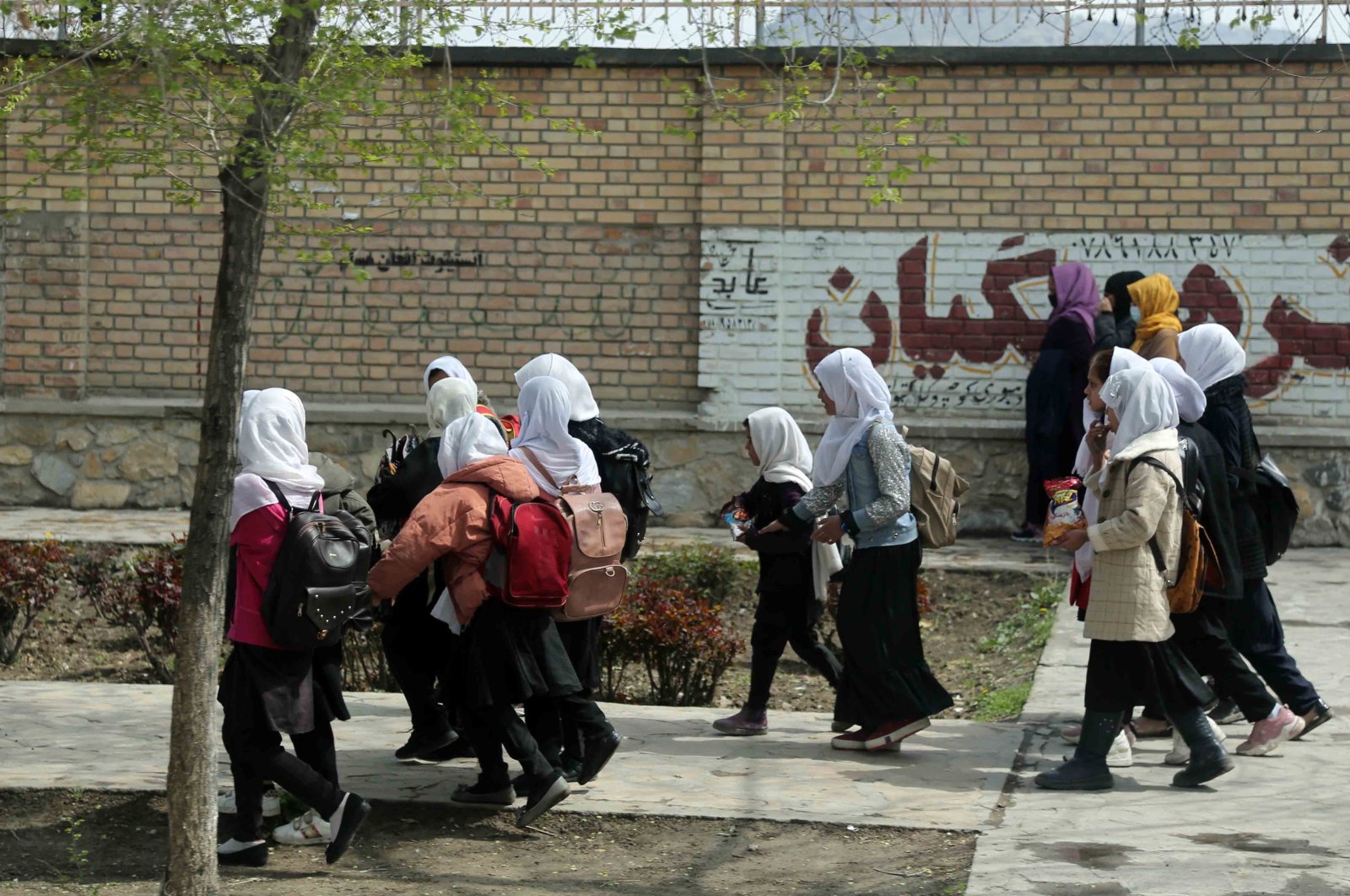 Afghan school girls leave their school for the day in Kabul, Afghanistan, June 5, 2023. (EPA Photo)