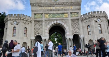 Students and parents wait in front of the Istanbul University entrance gate during the YKS exam, Istanbul, Türkiye, June 17, 2019. (AA Photo)