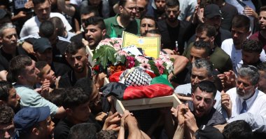 Palestinian mourners carry the body of 2-year-old Mohammad Haitham Tamimi during his funeral at his village of Nabi Saleh, near the West Bank city of Ramallah, June 6, 2023. (EPA Photo)