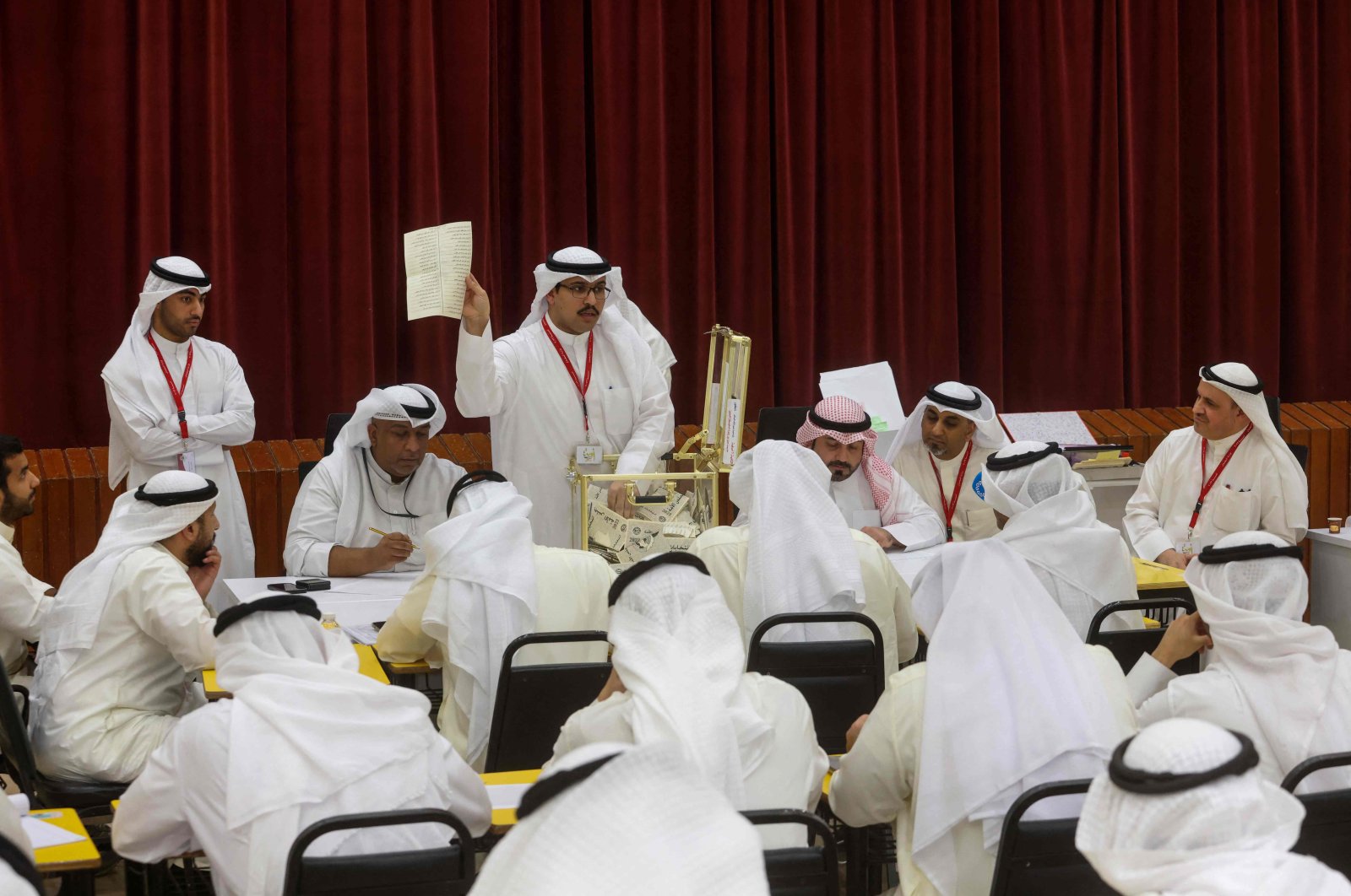 A Kuwaiti judge and his aides count the ballots at a polling station for parliamentary elections, in the Abdullah al-Salem district of Kuwait City, Kuwait, June 6, 2023. (AFP Photo)