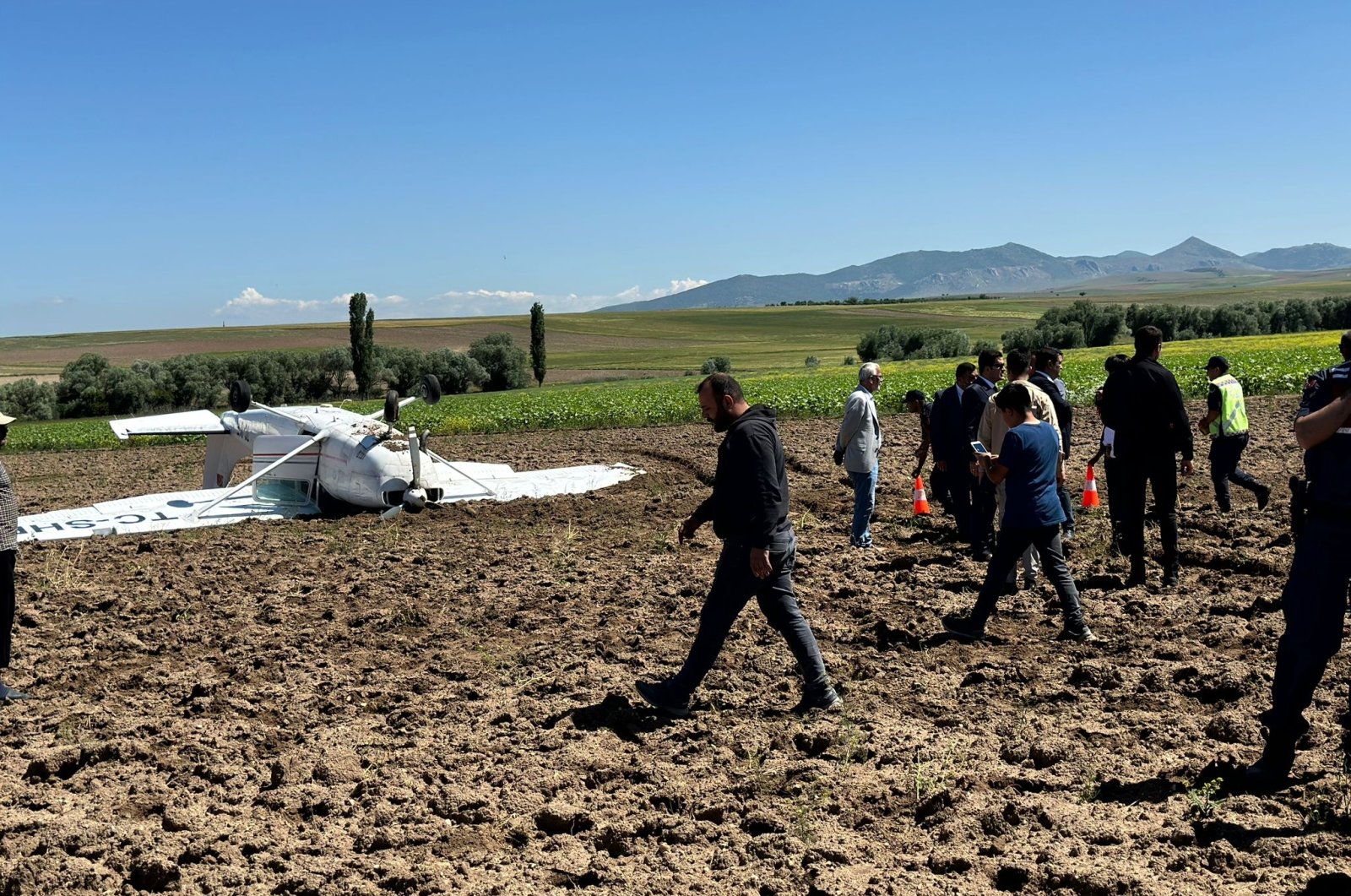The training plane is photographed after the crash on the fields in the area of Aksaray&#039;s Ortaköy district, central Türkiye, June 7, 2023. (AA Photo)