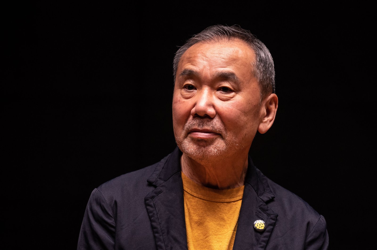 Japanese writer Haruki Murakami attends a press conference during a media preview of The Waseda International House of Literature, also known as Haruki Murakami Library, which is designed by Japanese architect Kengo Kuma, at Waseda University in Tokyo, Japan, Sept. 22, 2021. (AFP Photo)