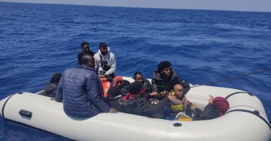 A group of irregular migrants floats in a liferaft as they wait for the Turkish coast guard to rescue them off the coast of western Izmir province, Türkiye, June 7, 2023. (AA Photo)