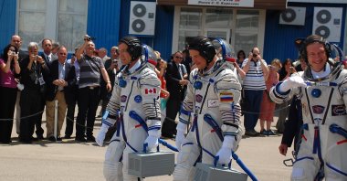 Soyuz spacecraft crew, R.Thirsk, R.Romanenko, F.DeWinne, ready for their flight to ISS,in Baikonur Cosmodrome, Kazakhstan May 27, 2009. (Shutterstock File Photo)