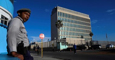 A police officer stands guard across the street from the U.S. Embassy in Havana, Cuba, May 26, 2023. (AFP Photo)