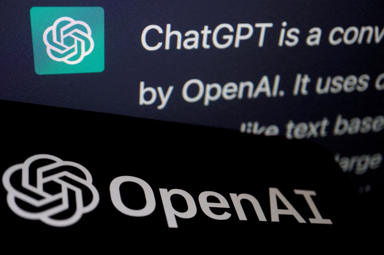 The logo of OpenAI is displayed near a response by its AI chatbot ChatGPT on its website, in this illustration picture, Feb. 9, 2023. (Reuters Photo)