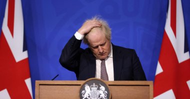  Britain's then-Prime Minister Boris Johnson gestures as he attends a media briefing on the latest COVID-19 update in the Downing Street briefing room in central London, Nov. 27, 2021. (AFP File Photo)