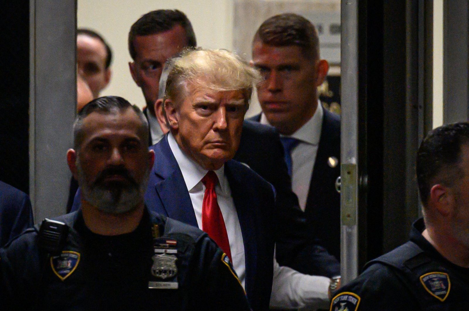 Former U.S. President Donald Trump makes his way inside the Manhattan Criminal Courthouse, New York, U.S., April 4, 2023. (AFP Photo)